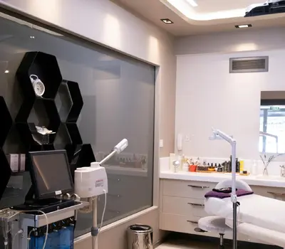A clean, modern aesthetic clinic treatment room